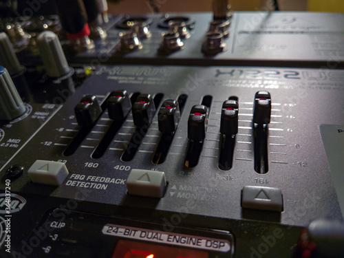 Close-up on the equalizer section of the mixer Behringer Xenyx X1222 photo