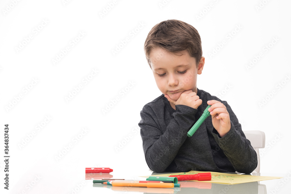 caucasian boy studying at home with expression of ideas and thoughts with white background, concept of home schooling caucasian boy studying at home with expression of ideas and thoughts with white background, concept of home schooling