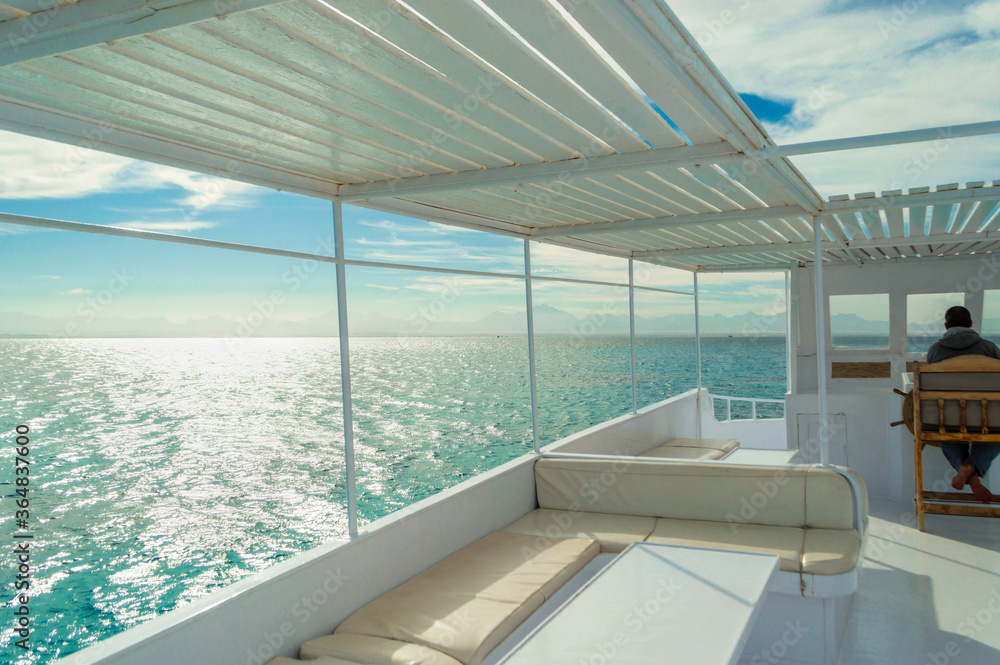 luxury vocation. yacht voyage. view from yacht to sunny horizon and sea waves.