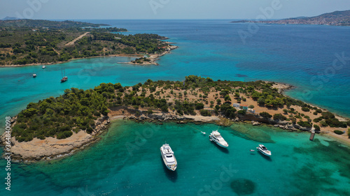 Aerial drone photo of Chinitsa bay a popular anchorage crystal clear turquoise sea bay for yachts and sail boats next to Porto Heli, Saronic gulf, Greece