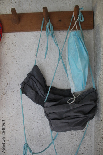 homemade masks hanging on wall