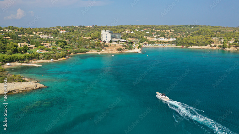 Aerial drone photo of Hinitsa bay a popular anchorage crystal clear turquoise sea bay for yachts and sail boats next to Porto Heli, Saronic gulf, Greece