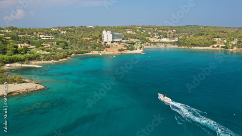Aerial drone photo of Hinitsa bay a popular anchorage crystal clear turquoise sea bay for yachts and sail boats next to Porto Heli, Saronic gulf, Greece photo