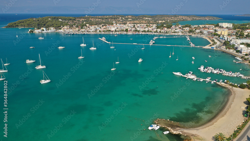 Obraz premium Aerial drone photo of beautiful fjord landscape forming turquoise beaches in small vegetated coves in Porto Heli a popular anchorage for yachts and sail boats, Argolida, Greece