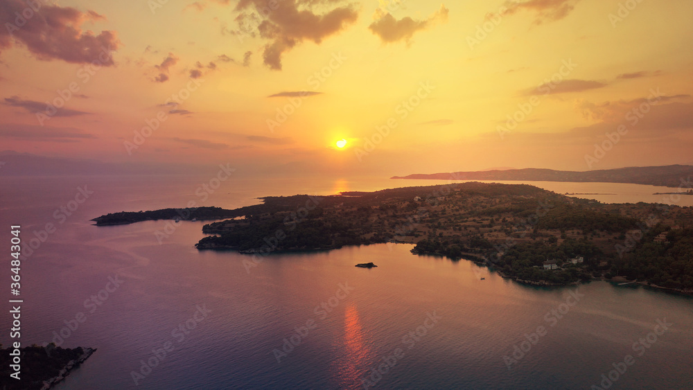Aerial drone panoramic photo of famous fjord seaside village and bay of Porto Heli in the heart of Argolida prefecture at sunset, Peloponnese, Greece Aerial drone panoramic photo of famous fjord seaside village and bay of Porto Heli in the heart of Argolida prefecture at sunset, Peloponnese, Greece