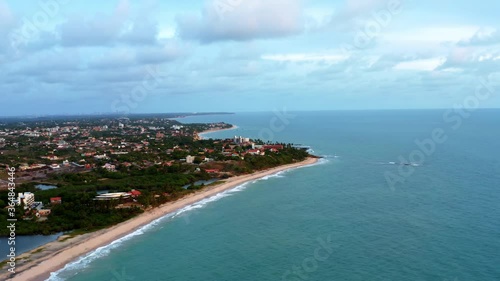 Wallpaper Mural Beautiful aerial drone left trucking shot the tropical coastline of Northern Brazil on golden Tabatinga beach with crystal blue water and beach homes along the coast. Torontodigital.ca