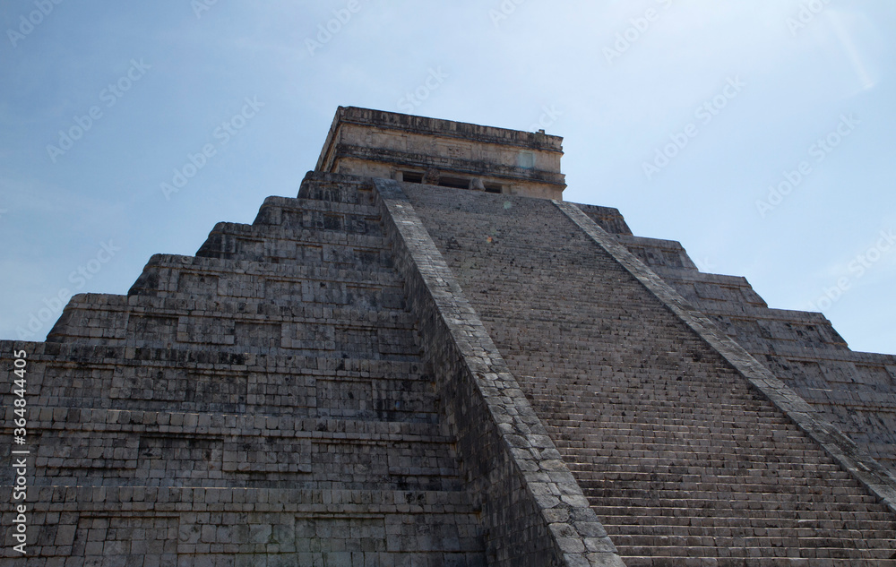 Seven world wonders. Ancient maya culture and architecture. Closeup of temple Kukulkan of Chichén Itza, mayan stone pyramid ruins in Yucatán, México. Seven world wonders. Ancient maya culture and architecture. Closeup of temple Kukulkan of Chichén Itza, mayan stone pyramid ruins in Yucatán, México.