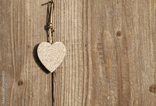Heart on wooden background. Love concept. 