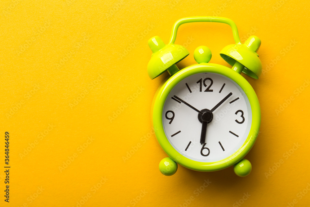 Clock Isolated On Yellow Background Clock Isolated On Yellow Background