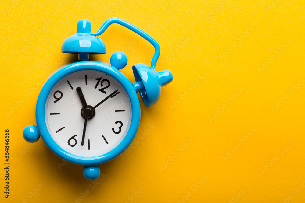 Clock Isolated On Yellow Background Clock Isolated On Yellow Background