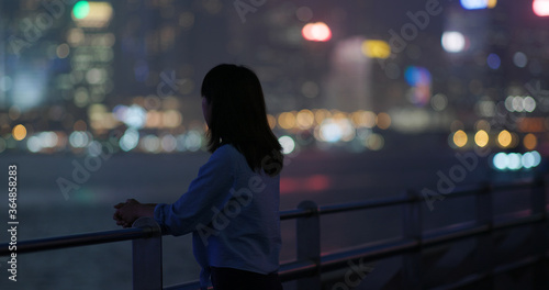 Photography Woman look at the city at night