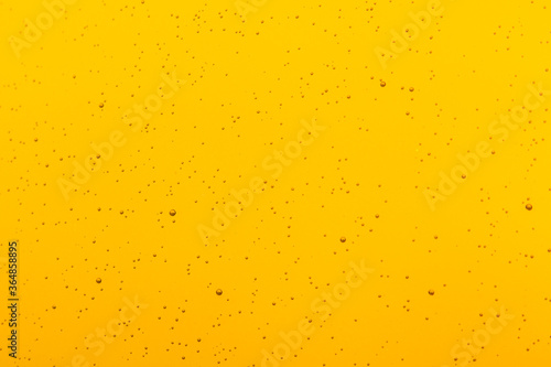 Raindrops on a yellow background.