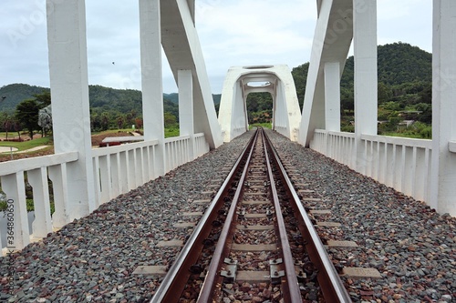 Fototapeta Naklejka Na Ścianę i Meble -  railway tracks.  Line of railway crossing in rural of Thailand. Northern Railway of Thailand In the White Bridge area, Lamphun Province.