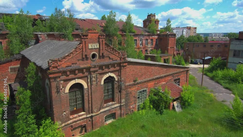 The drone shows from bottom to top the old building of the factory for the production of clothes, silk and other fabric products built back under the tsar of Russia The drone shows from bottom to top the old building of the factory for the production of clothes, silk and other fabric products built back under the tsar of Russia