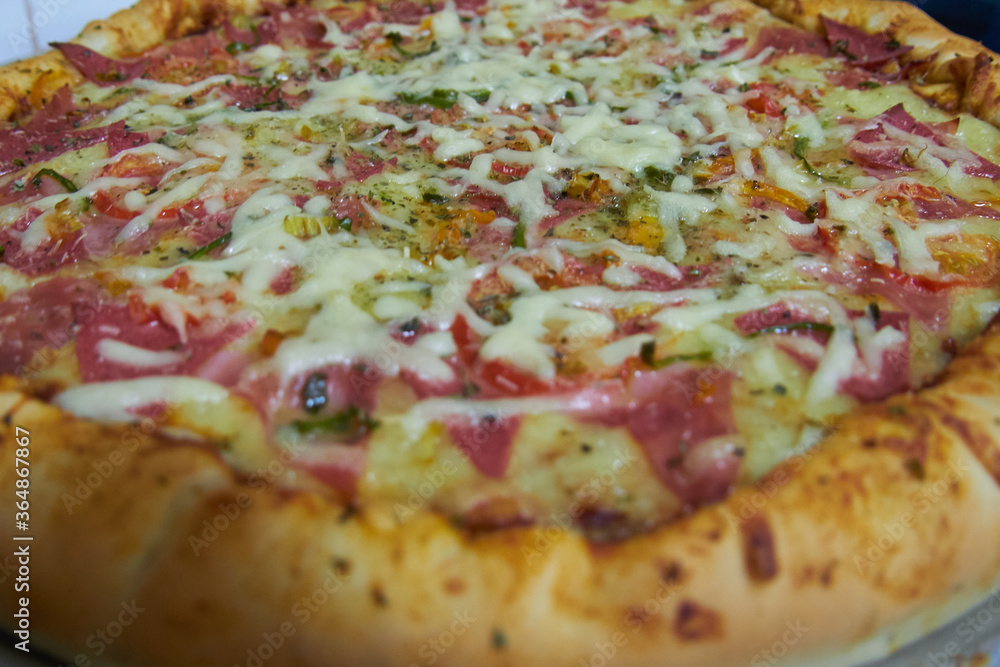 detail of ready to eat pizza, cheese, salami, pepper detail of ready to eat pizza, cheese, salami, pepper