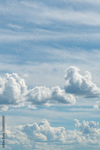 Canvas Print Cumulus and cirrus clouds portrait mode