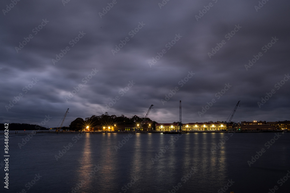 moody clouds over waterside warehouse