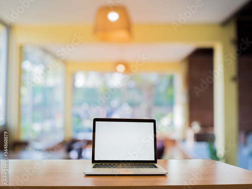 modern office interior with laptop on table. © bosavang
