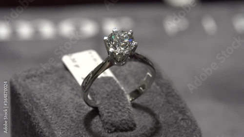 solitaire ring shine. Diamond ring hand made jewelery macro close up shoot in jeweler shop. hand made diamond soliaire ring photo