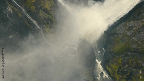 4k 60fps, Voringsfossen waterfall, green mountains, Mabodalen canyon Norway. National tourist Hardangervidda route Rv7, Eidfjord sightseeing tour photo