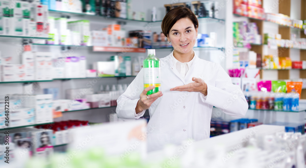 Pharmacist offering products of body care in pharmacy