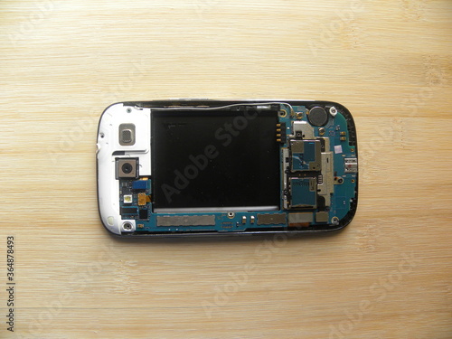 Wallpaper Mural Circuit board of Mobile phone kept on wooden table Torontodigital.ca