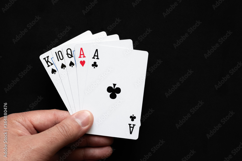 Obraz premium Pair combination in poker on black background. Poker combinations concept. 06.05.2020 Almaty, Kazakhstan.