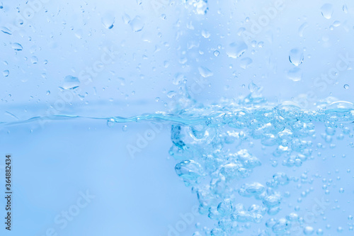 Splashing water bubbles, waves and drops isolated white background.