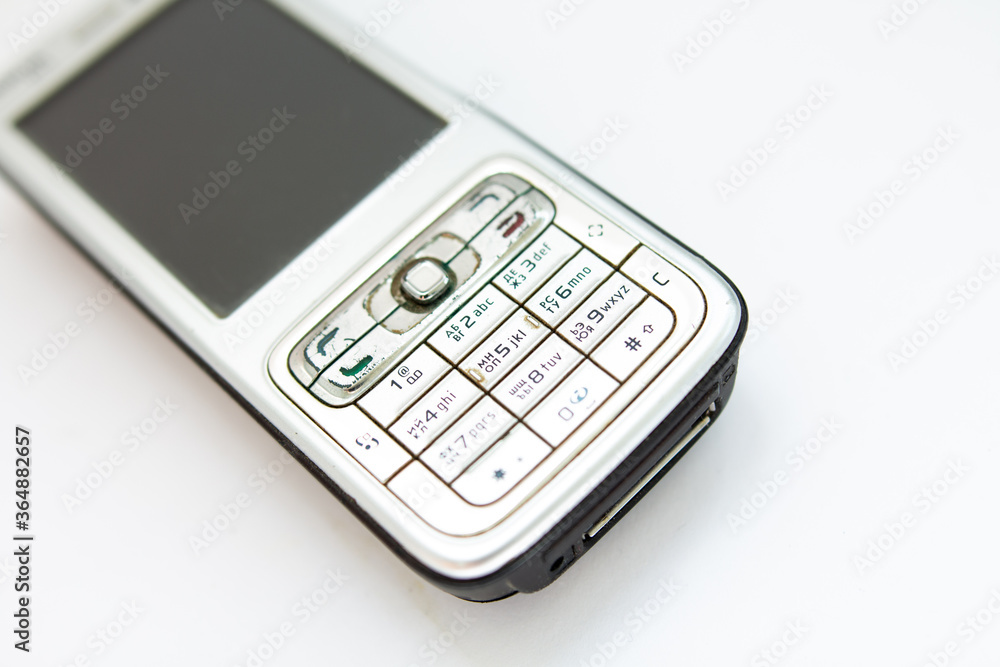 old push-button smartphone on a white background old push-button smartphone on a white background