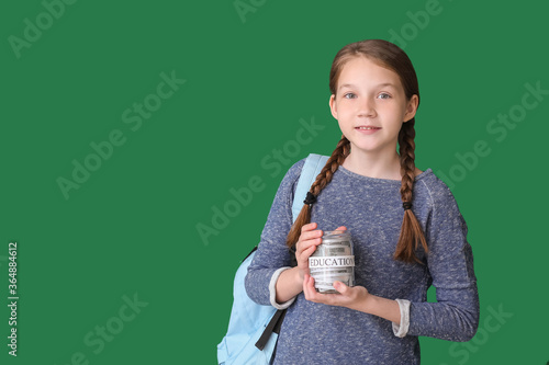 Girl with savings for educa...