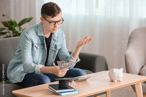 Teenage boy with savings fo...