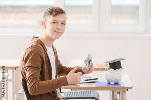 Teenage boy with savings fo...