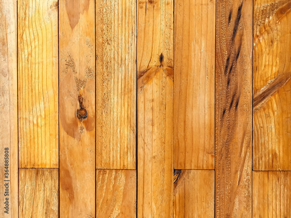 Naklejka premium Natural bright vertical brown wood pattern texture, Wood pattern blank for design Top down of the wooden table Pattern and hardwood surface as background and copy space in design background.