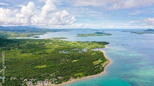 Seascape with islands in the early morning, aerial drone. Beautiful landscape on the island of Luzon. Caramoan Islands, Philippines. Malay archipelago with reefs and islands.