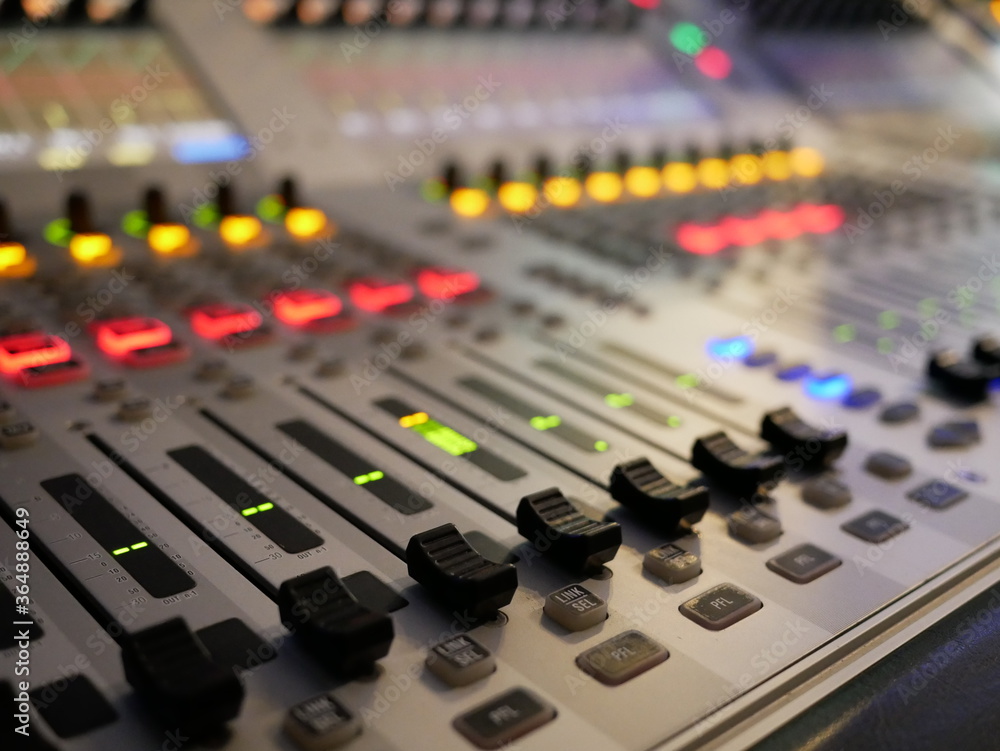 blurred of audio mixer control in studio TV station. blurred of audio mixer control in studio TV station.