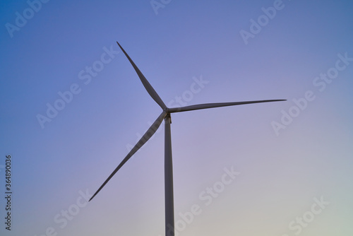 wind generators generate energy against the sky © Igor