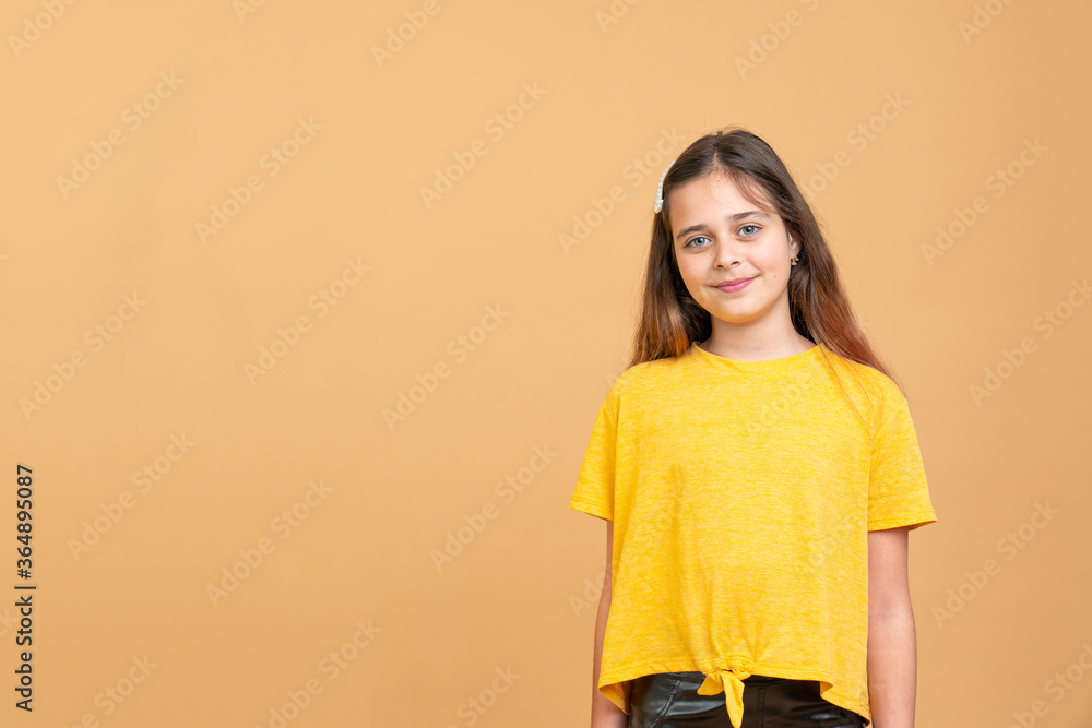 Portrait of pretty teenage girl in yellow t-shirt Portrait of pretty teenage girl in yellow t-shirt