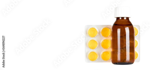 Throat ache pills in bister and syrup, isolated on white background. Copy space template, banner. photo