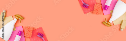 Banner made from cleaning products are on coral background.