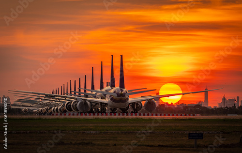 Papier peint The airplane parking at sunset time,Suvarnabhumi Airport ,Bangkok ,Thailand