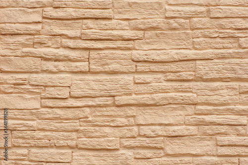 Close up stone wall. Beige stone wall, stone texture.