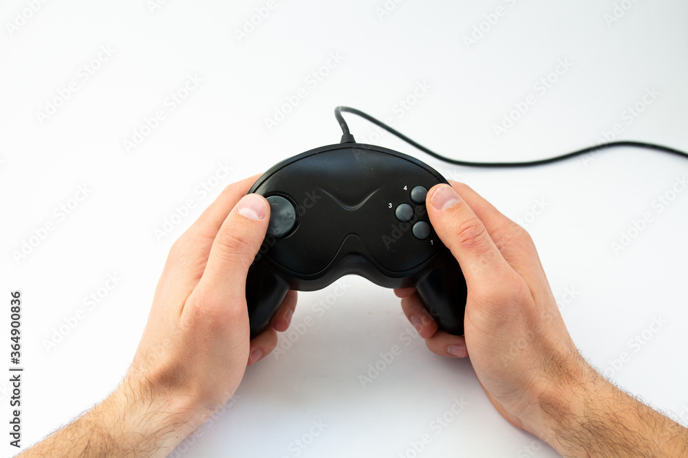 game joystick in hand on a white background game joystick in hand on a white background