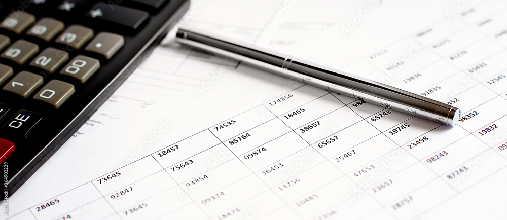 Graph Of Stock Market With Pen and calculator . business concept Graph Of Stock Market With Pen and calculator . business concept