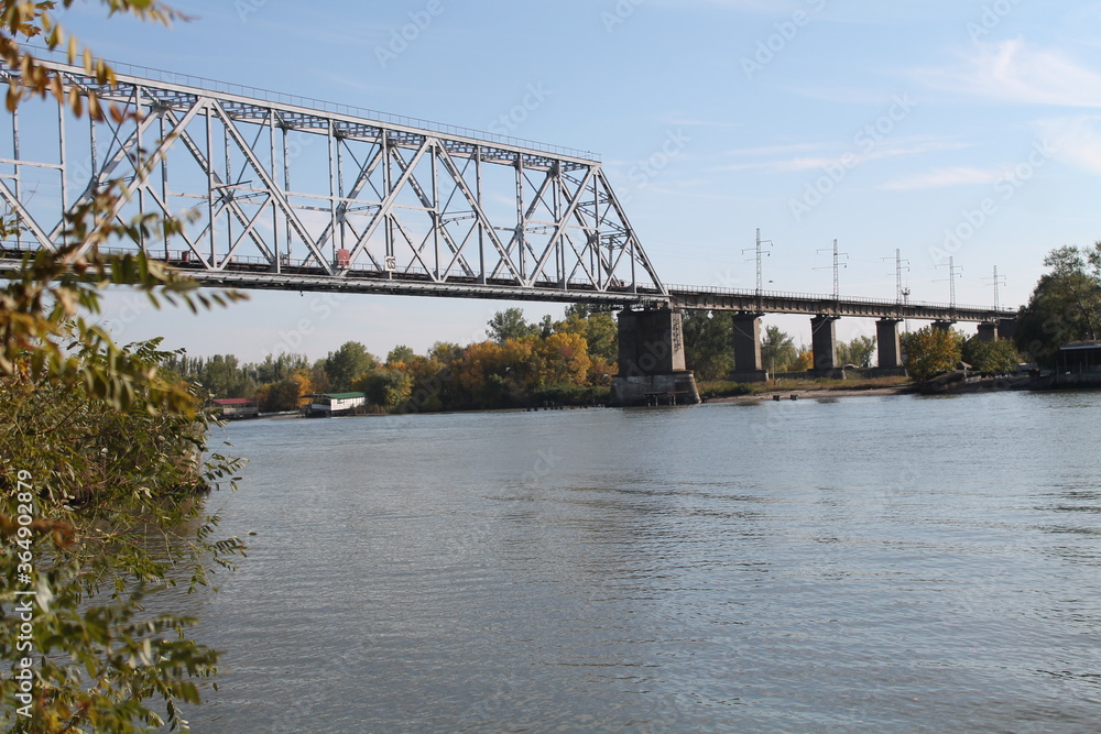 Fototapeta premium Bridge over the Don River against the backdrop of a beautiful sky
