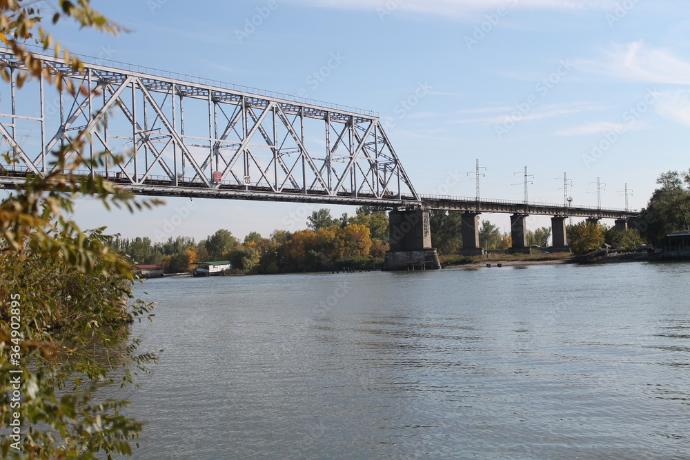 Fototapeta premium Bridge over the Don River against the backdrop of a beautiful sky