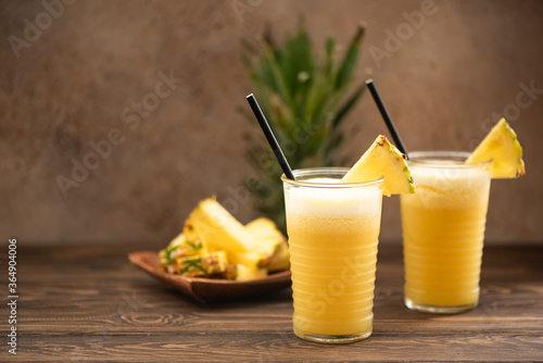 pineapple smoothie with fresh juice in glass glasses