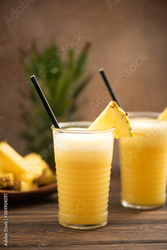 pineapple smoothie with fresh juice in glass glasses