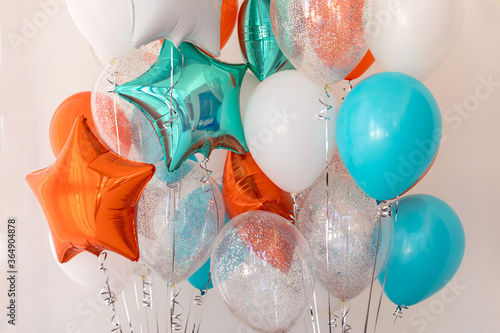 Print op canvas Composition of blue, silver, orange and transparent balloons with helium