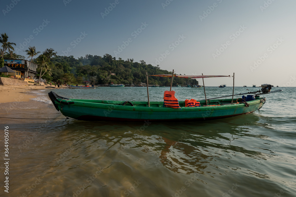 Vietnamese traditional boat at the beach in sunset. Phu Quoc island,. Vietnam Vietnamese traditional boat at the beach in sunset. Phu Quoc island,. Vietnam