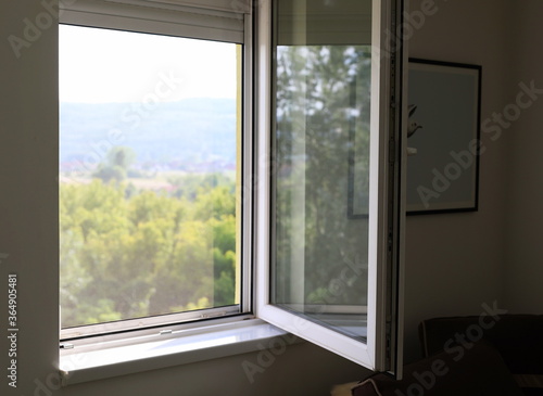 Open window with nature landscape view from inside house  apartment interior